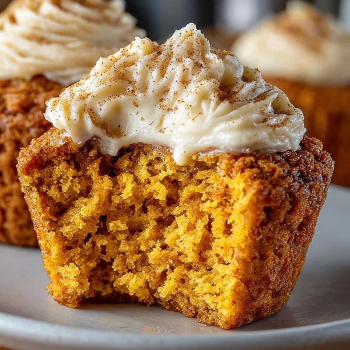 Freshly baked Pumpkin Cornbread Muffins with Cinnamon Butter, warm and ready to eat.