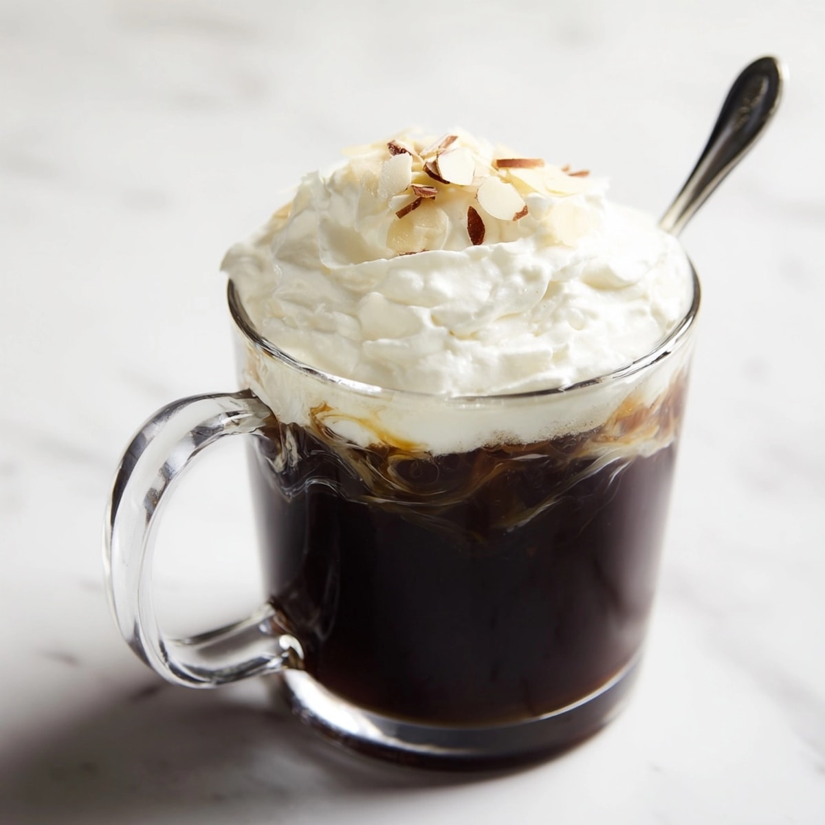 Cafe Amore Cocktail: A steaming mug topped with whipped cream and chocolate shavings.