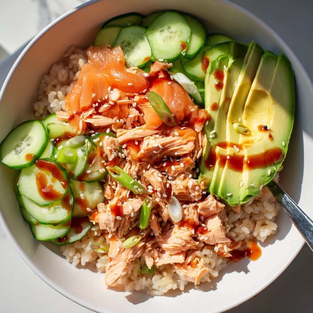 Quick and easy Leftover Salmon & Rice Bowl with vibrant toppings and flavors.  