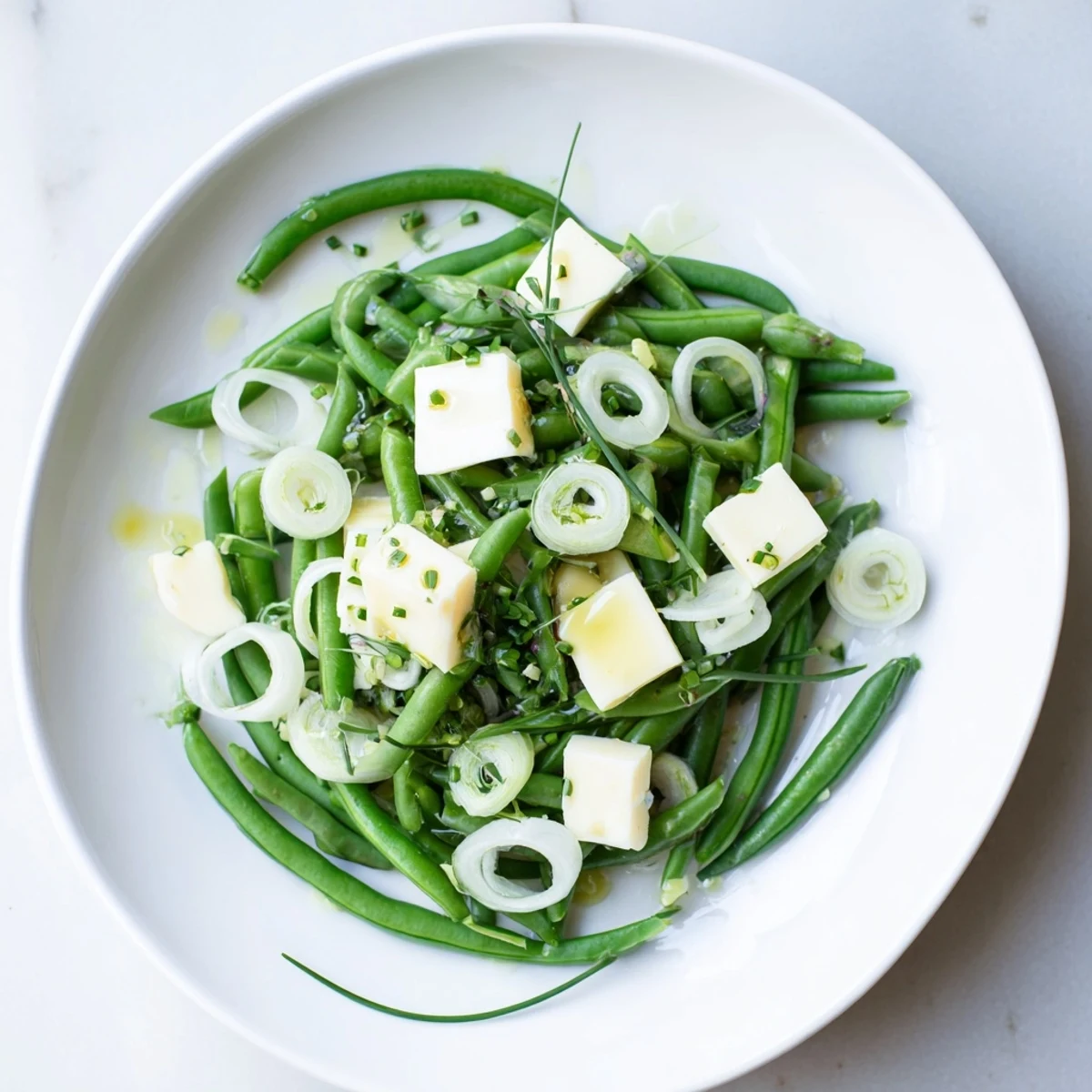 A gorgeous The English Ivy salad, showcasing blanched green beans with a bright lemon-honey dressing.