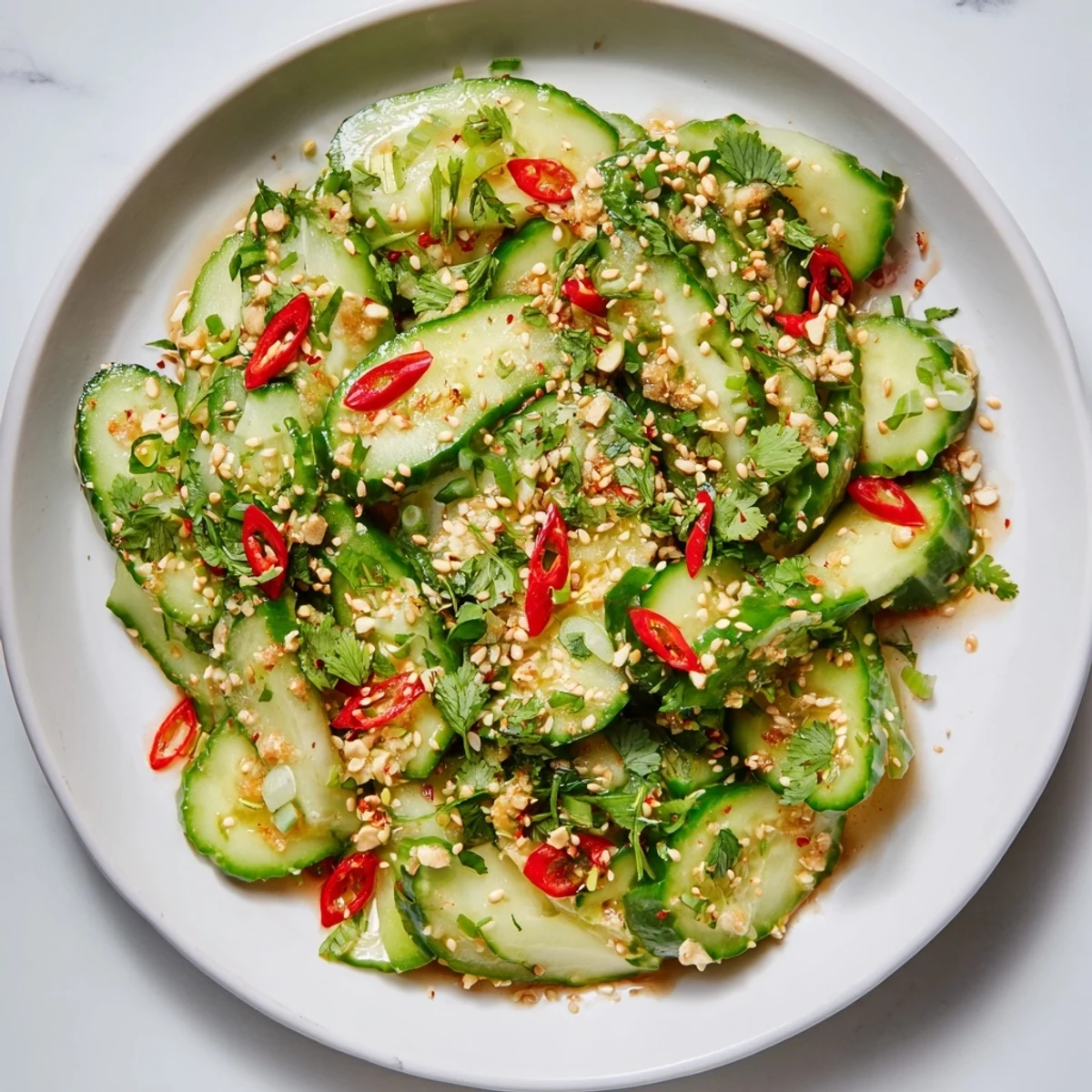 Fresh and tangy Shaken Asian-Style Cucumber Salad, an easy, vibrant side with sesame seeds.