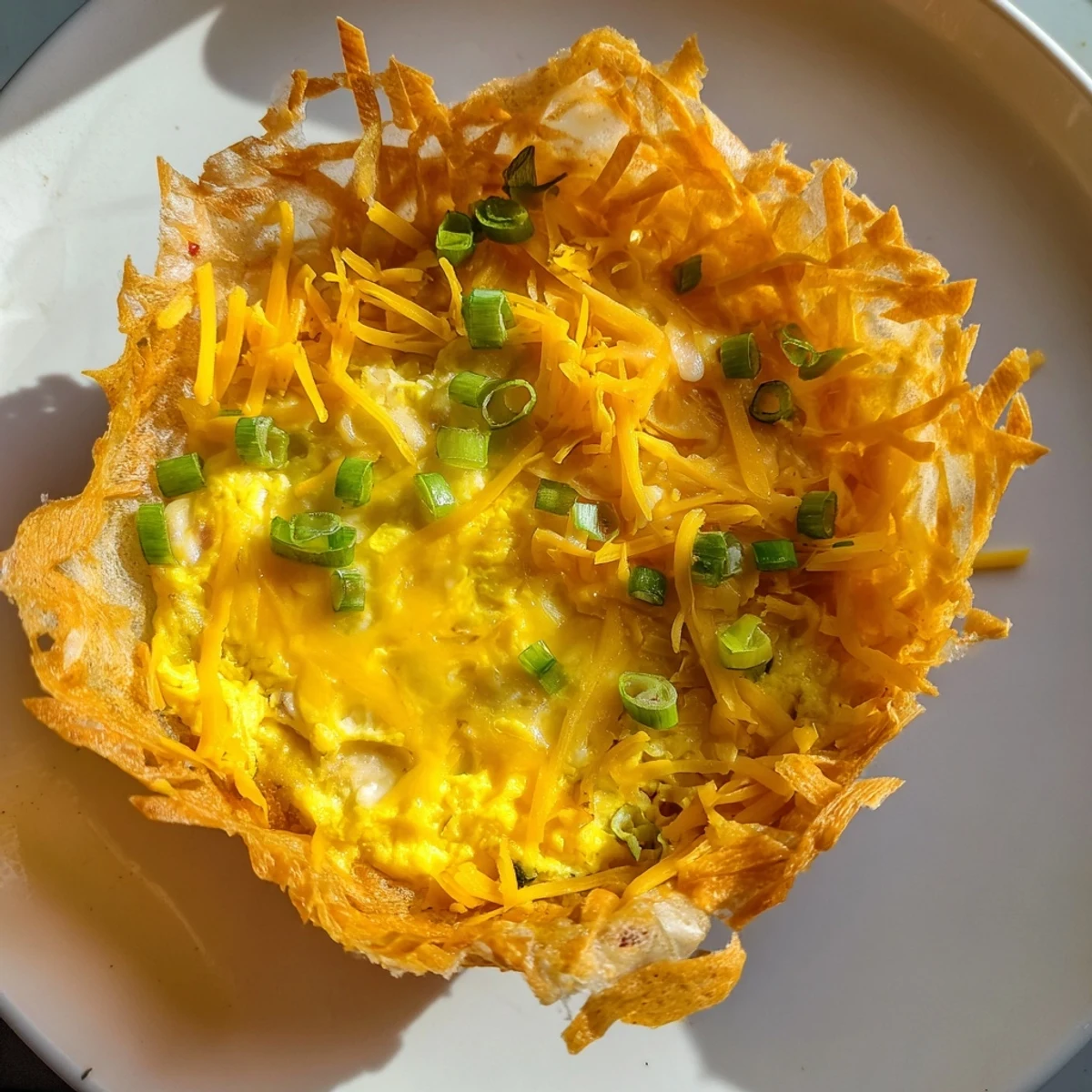 Golden-brown Rice Paper Egg & Cheese Fold, with melted cheese oozing from the crispy edges.