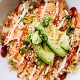 This Emily Mariko Salmon Rice Bowl features creamy avocado and perfectly seasoned rice, ready to eat.