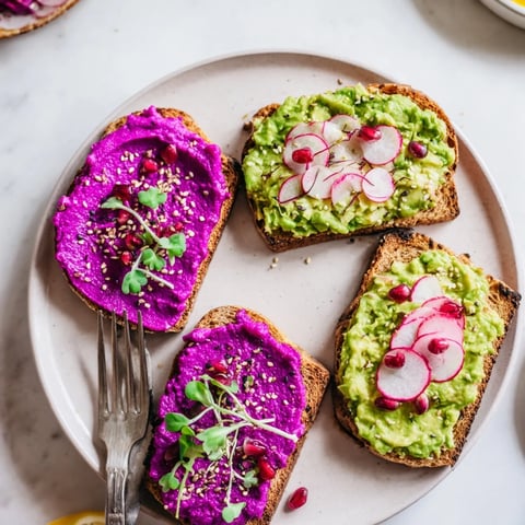 Bright & Bold Breakfast Toasts topped with colorful ube jam and fresh avocado slices.