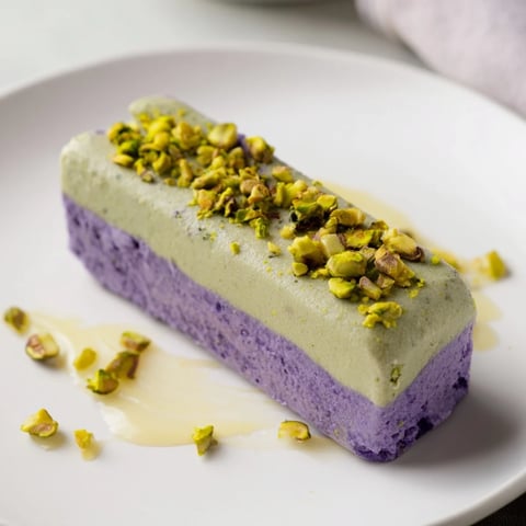 Creamy Ube & Pistachio Ice Cream Bars topped with chopped nuts, perfect for summer enjoyment.  