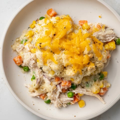 One-Pan Chicken Cobbler: imagine a bubbly, savory casserole topped with golden cheddar biscuits.