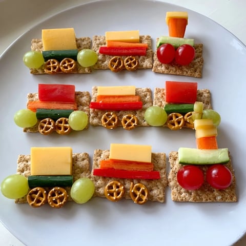 Choo Choo Train Snack Track loaded with colorful fruits, veggies, cheese—a fun and healthy snack idea.
