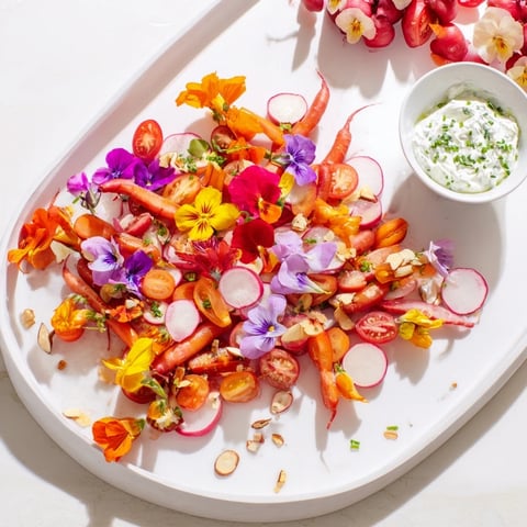 Vibrant Fairy Garden Platter with edible flowers, crunchy veggies, and creamy dips, ready to enjoy.
