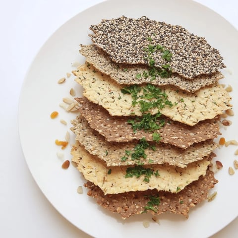 Layered fan of gourmet crackers, perfect for appetizers, displays a delicious variety for snacking.