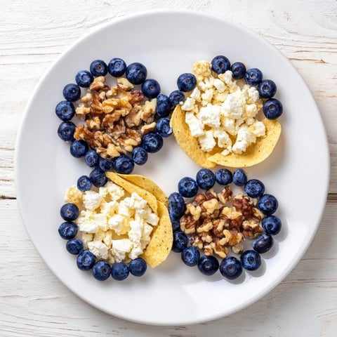 Vibrant Olympic Rings appetizer platter with fresh blueberries and flavorful blue cheese, ready to enjoy.