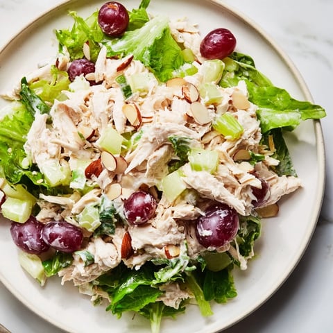 Delicious and creamy crispy chicken salad with fresh grapes and crisp celery, ready to serve.