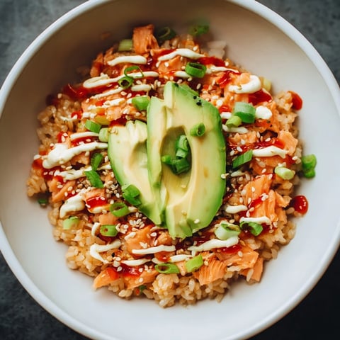 Flaky salmon and rice bowl: a colorful close-up of the easy Emily Mariko Salmon Rice Bowl.