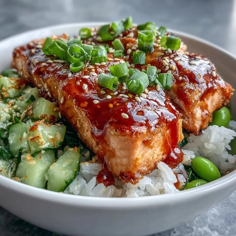 Flaky baked salmon, fluffy rice, and colorful cucumber-edamame salsa topped with creamy bang bang sauce.