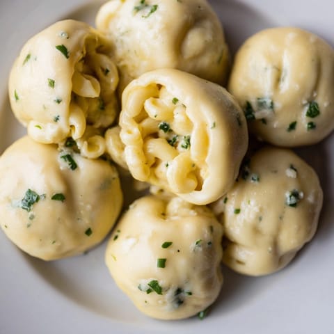 Warm, cheesy Mac and Cheese Garlic Dough Balls, served fresh with a sprinkle of parsley.