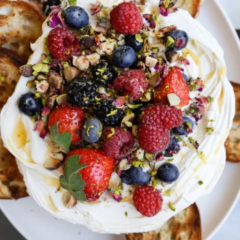 Colorful berries and creamy spread create a stunning Butter Board Dessert treat.  