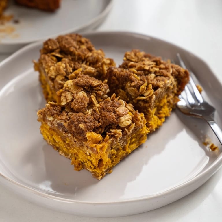 Deliciously spiced pumpkin bars with a crispy cornflake topping, ideal for breakfast.