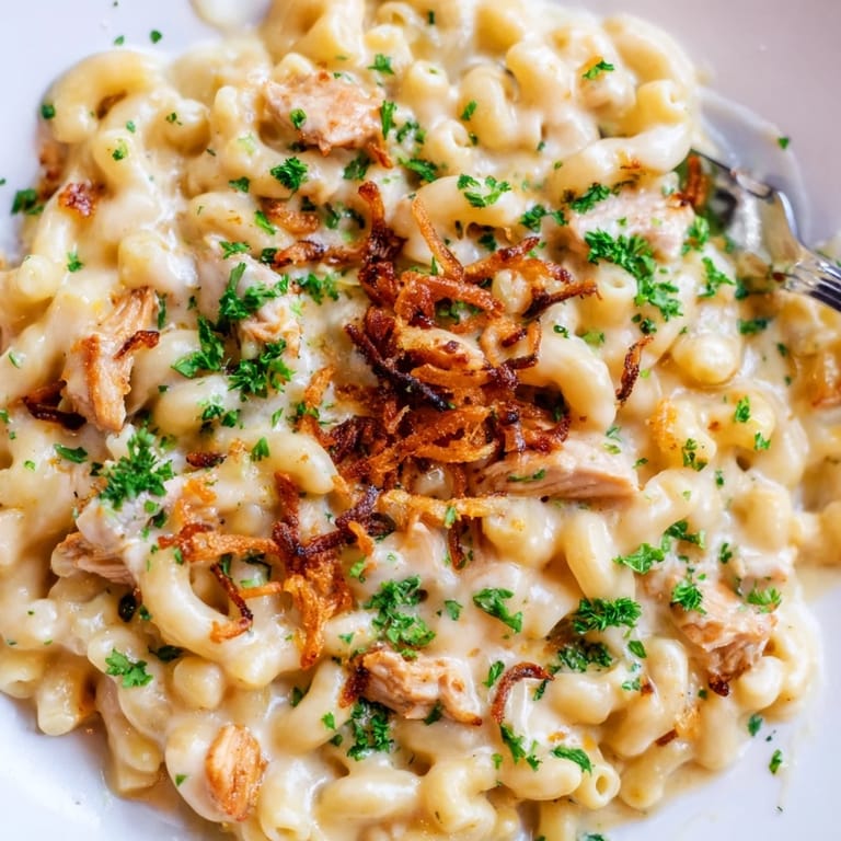 Savory One-Pot Honey BBQ Chicken Mac and Cheese with melted cheese and tender chicken.  