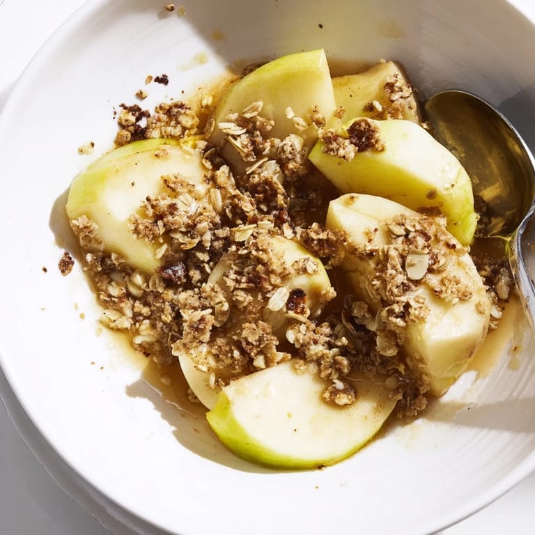 The oven-baked Best Apple Crisp, with a scoop of vanilla ice cream, offers a comforting treat.