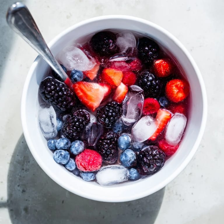 Enjoy a healthy Nature's Cereal Bowl bursting with colorful fruit and icy coconut water for a quick, vegan breakfast.